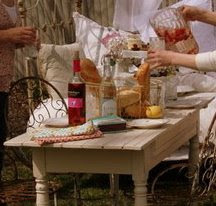 Pouring tea into a glass at a party