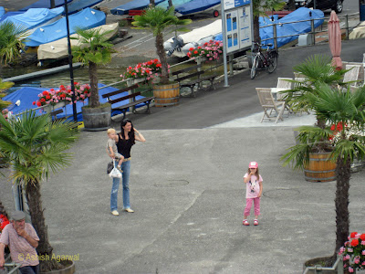 Mom and kids waiting to board the cruise ship on Lake Thun