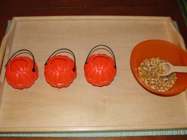 Spooning Corn into Miniature Jack-o'-Lanterns (Photo from Olives and Pickles)