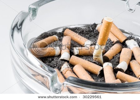 [stock-photo-cigarettes-butts-in-an-ashtray-30229561.jpg]