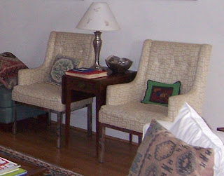 2 chairs with chrome legs that need to be upholstered