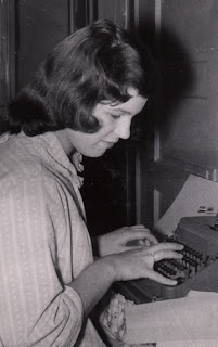 Robin Atkins writing a HS paper; 1959