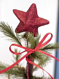 A small Red Glitter Star on a Christmas Tree Pic