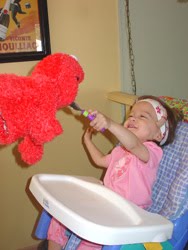 [2006.07.15EdenGivingElmoABite.jpg]