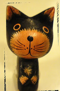 Out of focus wooden cat avatar