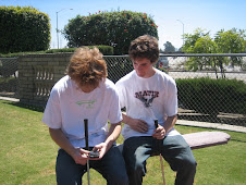 My two boys texting at Golf N Stuff