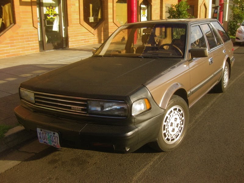 OLD PARKED CARS.: 1987 Nissan Maxima Wagon.
