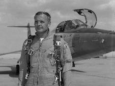 NASA research pilot Milt Thompson poses in front of an F-104 similar to the one from which he ejected on Dec. 20