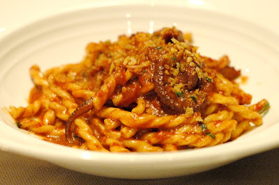 red wine braised octopus and bone marrow in fusilli