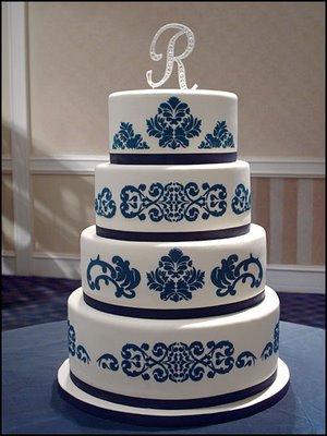 Exciting round 4 tier wedding cake with white icing as base and exquisite 