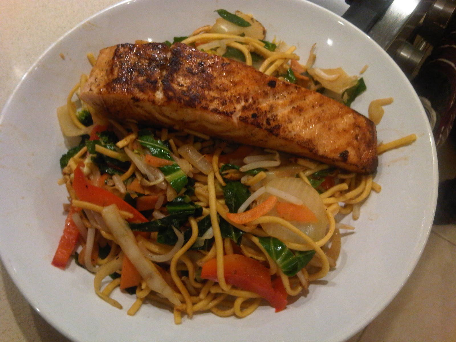 The Student Chef Grilled Salmon with noodles and stirfried vegetables.