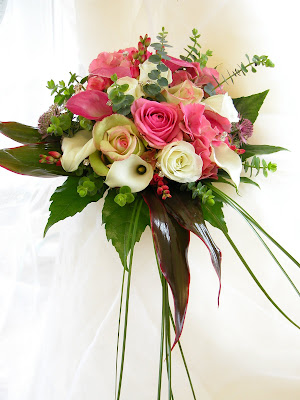 This Hand Tied Wedding Bouquet is created from Pink Ivory Calla Lilies 