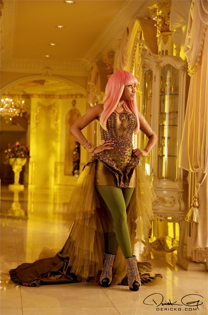 Above, Nicki wears a corseted cocktail dress 