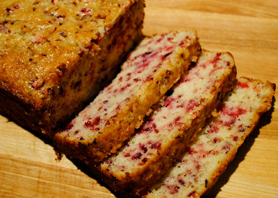 Grandmother's famous cranberry bread on a wood board