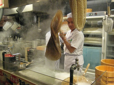 Udon chef boiling noodles