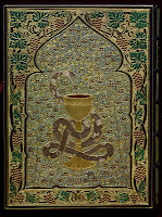 A photograph of the book's back cover, featuring a snake wound around a gold chalice, surrounded by a border of grapevines and a floral backdrop. The snake itself is set with snakeskin and the majority of the binding is gold.