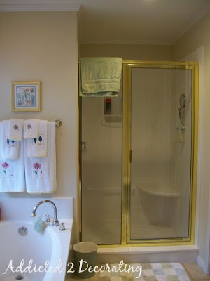 Master bathroom before redesign--the existing shower enclosure had a bright brass frame.