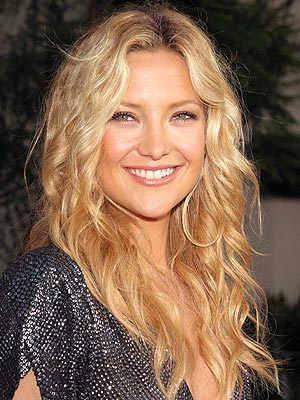 Hairstyle: Shoulder length hairstyle with large soft waves.
