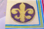 Gold and purple fleur de lis