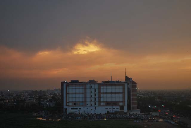 Sunset after heavy rains in Delhi - By Saurabh Gupta : Posted by VJ SHARMA at www.travellingcamera.com : Here are few photographs clicked by Saurabh Gupta from his Office terrace... (Noida)Its rare thing to have clear sky and get these colors during sunset... Normally there is lot of pollution and sky is not clear.. This time monsoons have flushed out all haziness from sky....Here is view of Sunset with Sector-21 apartments in the bottom...Its been more than one week we can clear and blue sky during day time... n these colors in the evening...Sunset color behind SPICE MALL in City Center of Noida....Colorful clouds look very angry and planning for showers during night...Another shot of the terrace during early time of the sunset...