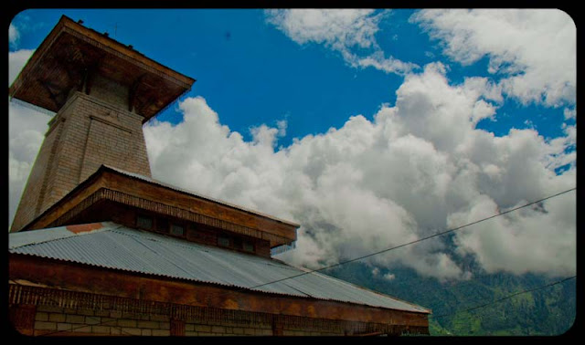 Very Old Manu Temple in Manali Town of Dev-Bhoomi (Himachal Pradesh) : Posted by VJ SHARMA at www.travellingcamera.com : Manu Temple is one of the main tourist attractions in Manali.. Its in Old Manali region and connected with main market through a road which passes through Manali Community Center (having some water sports in Beas...)... Here are some photographs of the place...Manu Rishi inside the Temple @ Old Manali, Himachal Pradesh... The temple is dedicated to the Indian sage Manu who is said to be the creator of the world and the writer of Manusmriti... This temple is considered as only Manu temple on earth and most of the foreigners come to see this temple... For Foreigners, this temple is must go place and other places can missed, but this can't be...Here is the first of Manu Temple on enetering Old Manali.... Most of the times its surrounded by clouds and it has amazing views of hills on other side and Beas River... There is a huge waterfall in front of this temple which can be seen from here but unapproachable because its on very high hills...Inside view of Manu Temple... Its made up of Wood and stone and marble is used for flooring... It looks amazing and most of the temples in Manali regions are made of Wood with very nice carving.... Deodar wood is considered as very good quality wood for any construction work... and its rarely available because of strict government rules in Himachal Pradesh...Here is a closer look at windows inside Manu Temple...I was not able to understand what it was but looked like very important thing because it was placed in main worship area...Clouds often visit the Temple and meet tourists :-)Manu Temple is very well located in Old Manali from where whole valley can be seen and have amazing views of hills on the other side... Clouds keep visiting inside the temple.. So sepnd 1 hr inside the temple and clouds may come to say 
