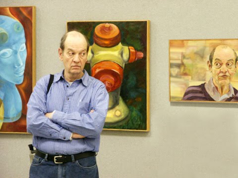 Ben with paintings by Emily White Kebert