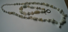 white necklace and bracelet set