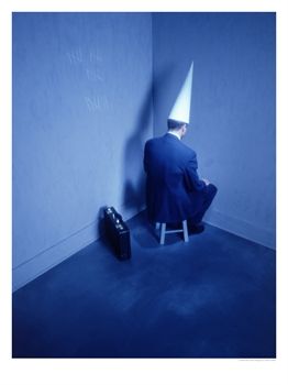 Businessman-Sitting-in-Corner-with-Dunce-Hat-Posters.jpg