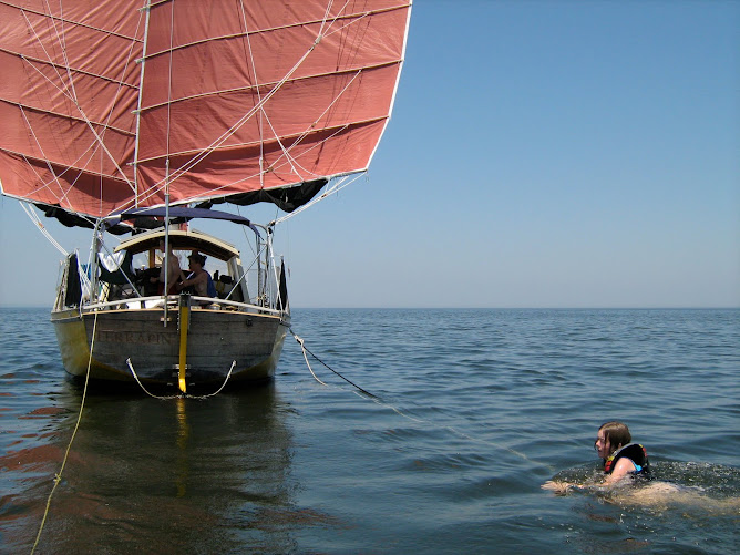 Rheannon in the water, Mike in the dingy.