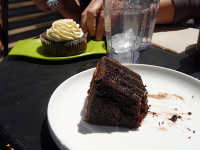 enjoying a piece of chocolate cake