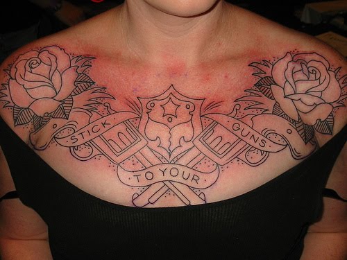 tattoos of stars on chest. Guns and roses chest tattoo idea for women.