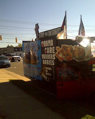 Truck with sign that says Obama Care Kills Babies