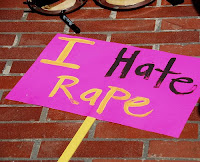 protest sign that says I hate rape