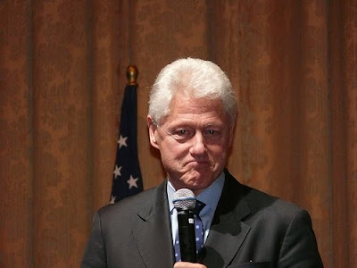 photo of a deranged looking Bill Clinton