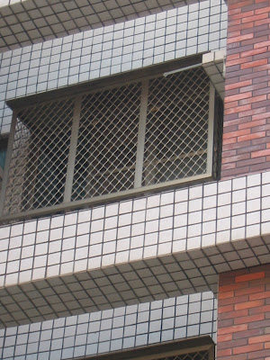 bars on windows in apartment in Tainan City Taiwan