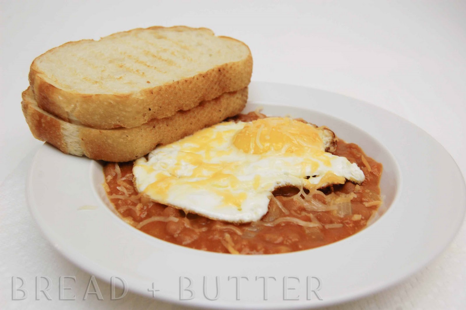 Bread + Butter Pork and Beans with a Fried egg