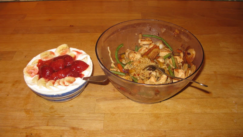 Two bowls — Left: Cottage Cheese, Vanilla Yogurt, Frozen banas and strawberries. Right: Chicken wok with noodles and veggies