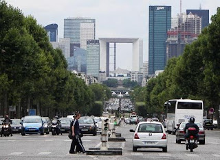 Rush hour in Paris is dominated by small cars and motorcycles.