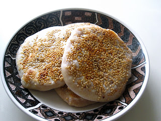 Morsels of Life - Fried Taro Biscuits - Sweet taro paste pan fried inside a flaky bun, topped with sesame seeds.
