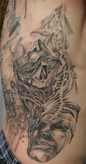 Face Skull Rib Tattoo Design
