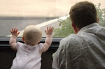 My hubby and baby K looking out the window