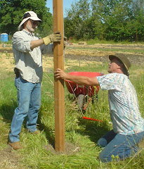 Rann and Chris building the fence