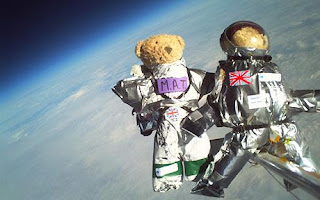 Two teddy bears have been sent on a space mission, propelled 100,000ft into the stratosphere on a weather balloon.