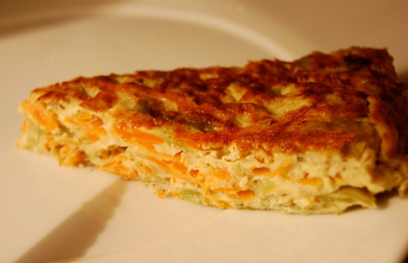 RAICES Y PATAS “NUESTRA” TORTILLA DE ZANAHORIA Y CEBOLLA.