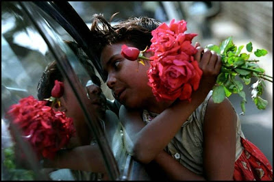 Child Selling Roses On Street of Mumbai