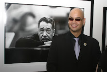 Paul Ellington in front of a portrait of his Grandfather at The Morrison Hotel Gallery in New York