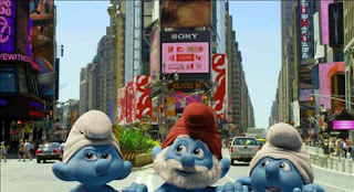 Three Smurfs, with Papa Smurf in the middle, peeking out of a manhole in New York's Time Square and enjoying the sights.