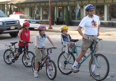 Image of bicycling family