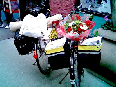 Image of two bikes with fully loaded pannier baskets