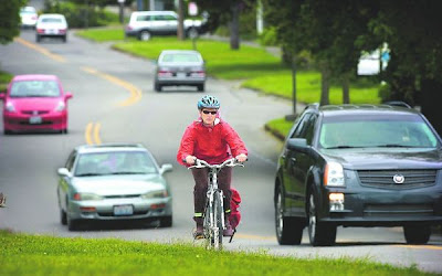 Arts writer Rosemary Ponnekanti pedals on way to assignment.